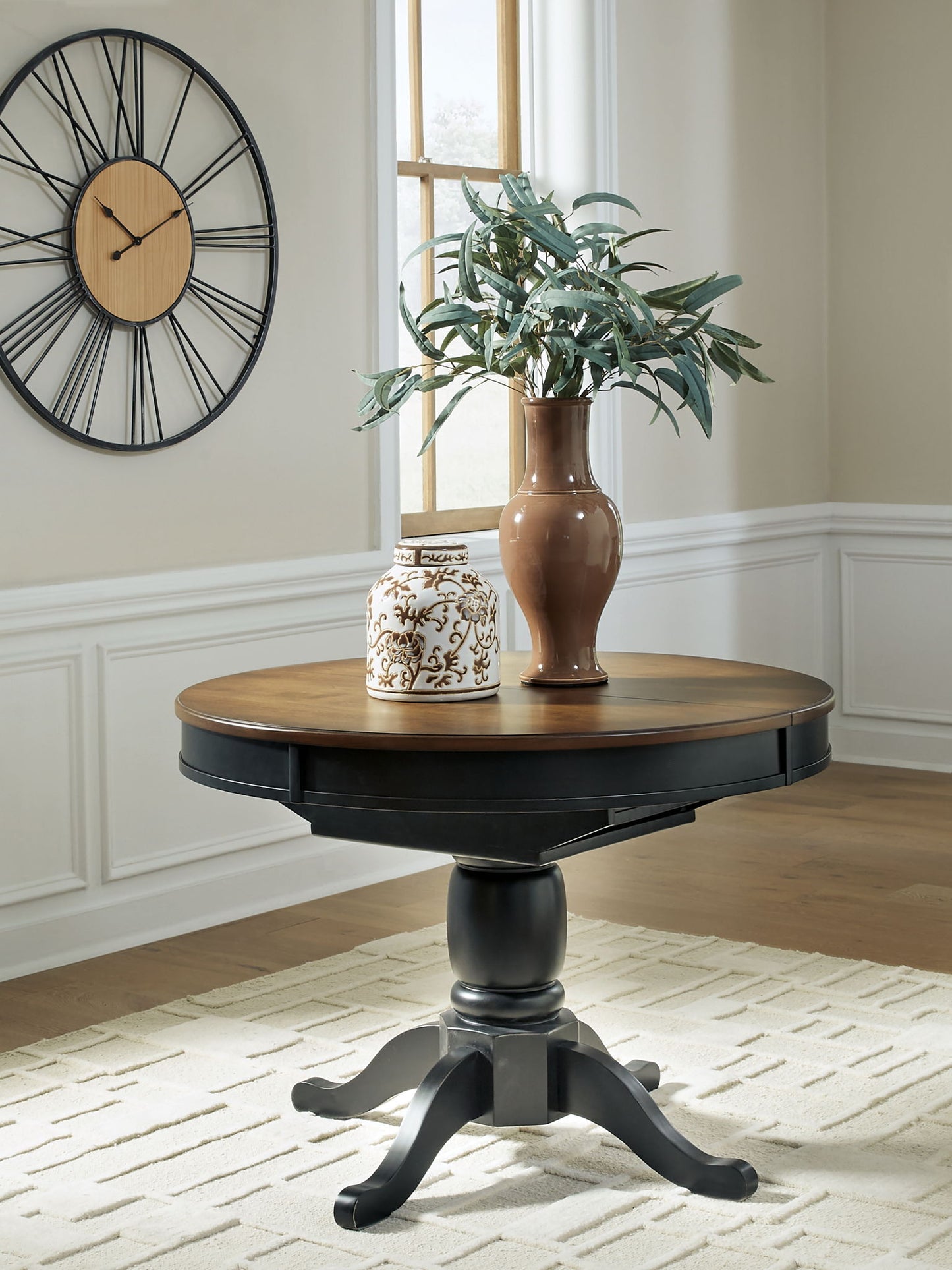 Clorazi - Oval Dining Room Butterfly Extension Table - Black / Brown